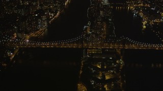 4K aerial stock footage Approaching the Queensboro Bridge, tilt down, New York, New York, night Aerial Stock Footage | AX85_100