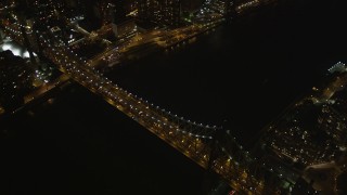 4K aerial stock footage Fly by Queensboro Bridge, reveal Midtown Manhattan, New York, New York, night Aerial Stock Footage | AX85_101