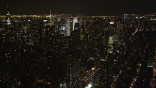 4K aerial stock footage Flying by Midtown Manhattan, seen from East River, New York, New York, night Aerial Stock Footage | AX85_102