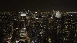 4K aerial stock footage Flying by Midtown Manhattan skyscrapers, New York, New York, night Aerial Stock Footage | AX85_104