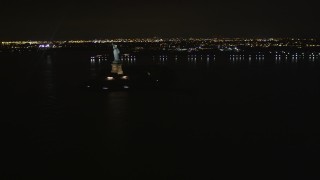 4K aerial stock footage Approaching the Statue of Liberty, New York, New York, night Aerial Stock Footage | AX85_134