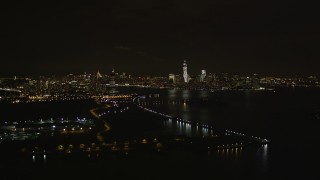 4K aerial stock footage Flying away from Lower Manhattan skyline, New York, New York, night Aerial Stock Footage | AX85_137