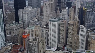 4K aerial stock footage of passing by Lower Manhattan skyscrapers and city buildings in New York City Aerial Stock Footage | AX86_011