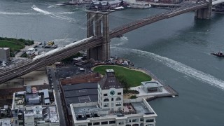 AX86_022 - 4K aerial stock footage fly over Brooklyn condo high-rise toward the Brooklyn Bridge, New York City