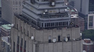 4K aerial stock footage of tourists on the Empire State Building's observation decks in Midtown, New York City Aerial Stock Footage | AX86_034