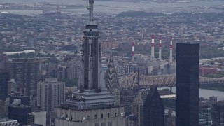 4K aerial stock footage of circling the Empire State Building's spire in Midtown Manhattan, New York City Aerial Stock Footage | AX86_037