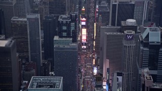 AX86_056 - 4K aerial stock footage tilting to a view of traffic and tourists in Times Square in Midtown, New York City