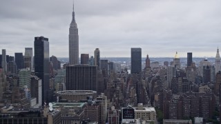 4K aerial stock footage fly past Midtown Manhattan, reveal Empire State Building, New York City Aerial Stock Footage | AX86_061