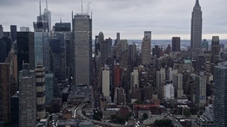 AX86_062 - 4K aerial stock footage fly past Midtown Manhattan skyscrapers and Empire State Building, New York City