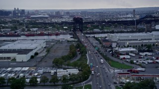 AX86_087 - 4K aerial stock footage of approaching a small bridge spanning the Passaic River in Kearny, New Jersey