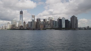 4K aerial stock footage Tilt to Lower Manhattan skyline, approach from low altitude, New York, New York Aerial Stock Footage | AX87_015