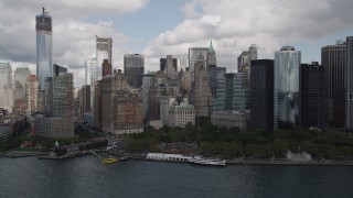 AX87_016 - 4K aerial stock footage Approaching Lower Manhattan skyscrapers, Battery Park, New York, New York