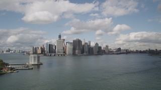 4K aerial stock footage Flying by Lower Manhattan skyline, from Governors Island, New York, New York Aerial Stock Footage | AX87_045