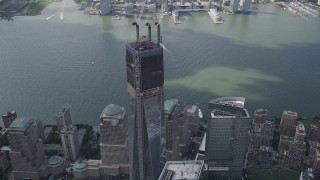 4K aerial stock footage Flying by top of One World Trade Center, Lower Manhattan, New York, New York Aerial Stock Footage | AX87_071