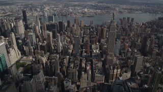 4K aerial stock footage Flying by the Empire State Building, Midtown Manhattan, New York, New York Aerial Stock Footage | AX87_103