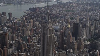 4K aerial stock footage Flying by top of Empire State Building, Midtown Manhattan, New York Aerial Stock Footage | AX87_104