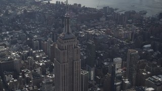 4K aerial stock footage Flying by top of the Empire State Building, Midtown Manhattan, New York Aerial Stock Footage | AX87_107