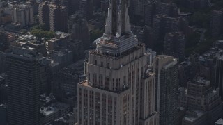 4K aerial stock footage Flying by top decks of Empire State Building, Midtown Manhattan, New York Aerial Stock Footage | AX87_108