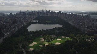 4K aerial stock footage Flying by Central Park, seen from Harlem, New York, New York Aerial Stock Footage | AX87_131