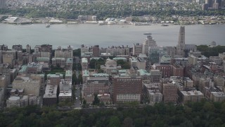 4K aerial stock footage Flying by Columbia University, with views of the Hudson River, New York, New York Aerial Stock Footage | AX87_159