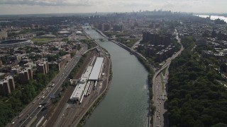 4K aerial stock footage Tilt from Harlem River, Washington Heights, reveal Harlem, New York, New York Aerial Stock Footage | AX87_175