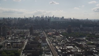 4K aerial stock footage Flying by Midtown Manhattan skyline, seen from Harlem, New York, New York Aerial Stock Footage | AX87_181