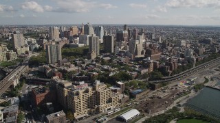 4K aerial stock footage of flying by skyscrapers, seen from Brooklyn Bridge, Brooklyn, New York Aerial Stock Footage | AX88_004