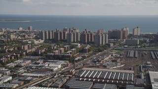 4K aerial stock footage of approaching apartments on coast, Coney Island, Brooklyn, New York Aerial Stock Footage | AX88_041