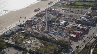 AX88_044 - 4K aerial stock footage flyby roller coaster and Ferris wheel at Luna Park, Coney Island, Brooklyn, New York