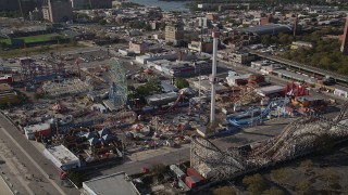 4K aerial stock footage of flying by Luna Park rides in Coney Island, Brooklyn, New York, New York Aerial Stock Footage | AX88_056