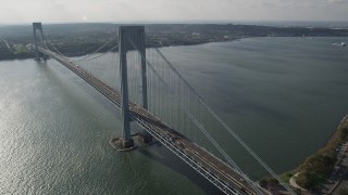 4K aerial stock footage pan across Verrazano-Narrows Bridge, spanning The Narrows, New York, New York Aerial Stock Footage | AX88_087