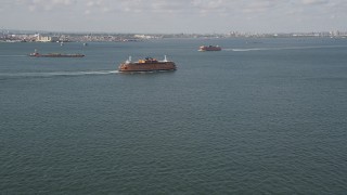 4K aerial stock footage of two Staten Island Ferries sailing New York Harbor, New York, New York Aerial Stock Footage | AX88_091