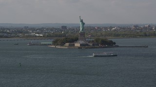 4K aerial stock footage of flying by the front of the Statue of Liberty, New York, New York Aerial Stock Footage | AX88_101