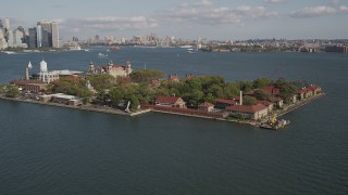 4K aerial stock footage of flying by historic Ellis Island, New York, New York Aerial Stock Footage | AX88_112