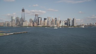 4K aerial stock footage tilt up to approach Lower Manhattan skyline, New York, New York Aerial Stock Footage | AX88_113