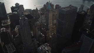 4K aerial stock footage of approaching 40 Wall Street and Lower Manhattan skyscrapers, New York, New York Aerial Stock Footage | AX88_129