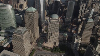 4K aerial stock footage of flying by skyscrapers by the World Trade Center Memorial, Lower Manhattan, New York Aerial Stock Footage | AX88_135