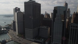 4K aerial stock footage of flying by skyscrapers in Lower Manhattan by the East River, New York, New York Aerial Stock Footage | AX88_144