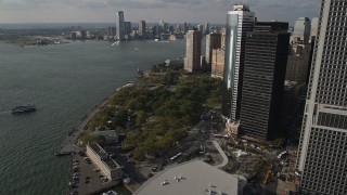 AX88_145 - 4K aerial stock footage of approaching Battery Park by skyscrapers in Lower Manhattan, New York, New York