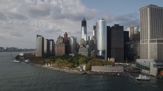 4K aerial stock footage of Freedom Tower, seen while flying by Battery Park, Lower Manhattan, New York Aerial Stock Footage | AX88_163