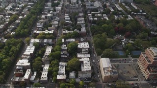 AX88_170 - 4K aerial stock footage of flying over row houses by Hamilton Park, Jersey City, New Jersey