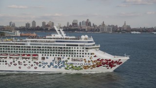 AX88_180 - 4K aerial stock footage track a cruise ship sailing New York Harbor, New York, New York