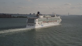 4K aerial stock footage of flying by the side of a cruise ship sailing New York Harbor, New York, New York Aerial Stock Footage | AX88_185