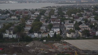 4K aerial stock footage of approaching urban residential neighborhoods, Jersey City, New Jersey Aerial Stock Footage | AX88_197