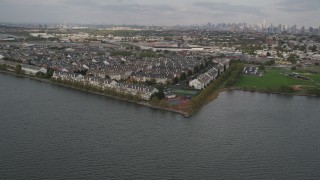 4K aerial stock footage of flying by waterfront condominiums, Jersey City, New Jersey Aerial Stock Footage | AX88_201