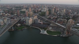 4K aerial stock footage Approaching Brooklyn, Manhattan and Brooklyn Bridges, New York, sunset Aerial Stock Footage | AX89_010