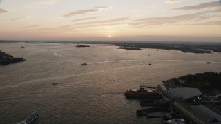 4K aerial stock footage Approaching boats, New York Harbor, New York, New York, sunset Aerial Stock Footage | AX89_019