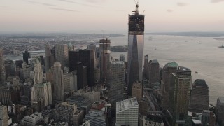 4K aerial stock footage of One World Trade Center, Lower Manhattan skyscrapers, New York, sunset Aerial Stock Footage | AX89_027