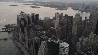 4K aerial stock footage Flying by Lower Manhattan skyscrapers, East River, New York, New York, twilight  Aerial Stock Footage | AX89_032