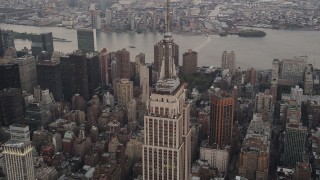 4K aerial stock footage Flying by the Empire State Building, Midtown Manhattan, New York, twilight Aerial Stock Footage | AX89_045